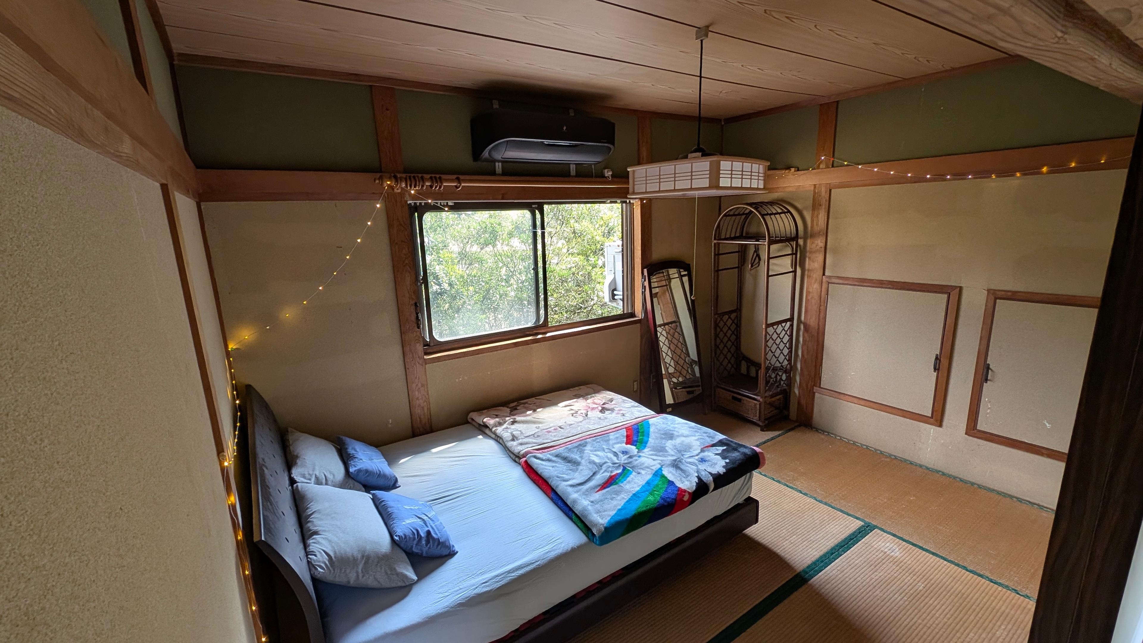 Traditional tatami room with low table and floor seating at IKADA